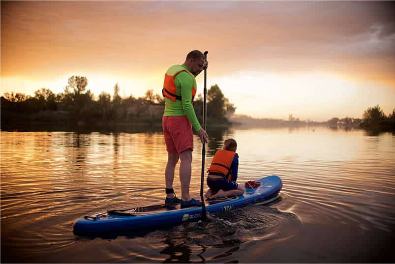 father and daughter on a paddle