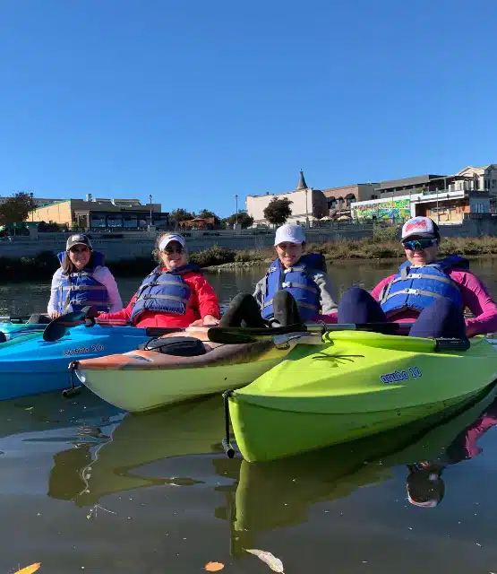 a group of proffesionals doing a group tour, kayaking
